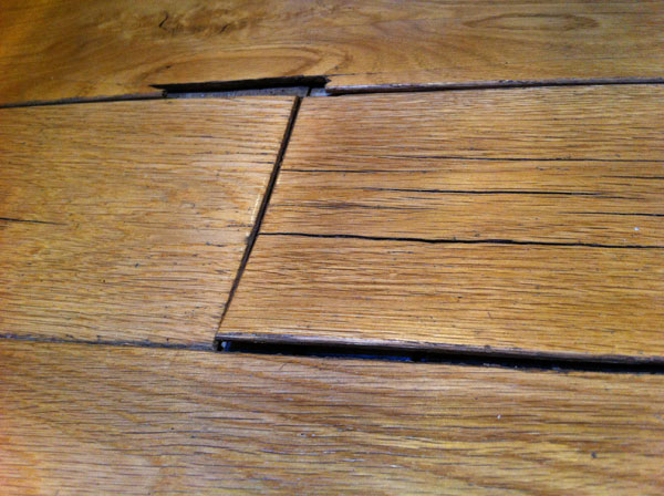 Why does my wood flooring have black around the edges?